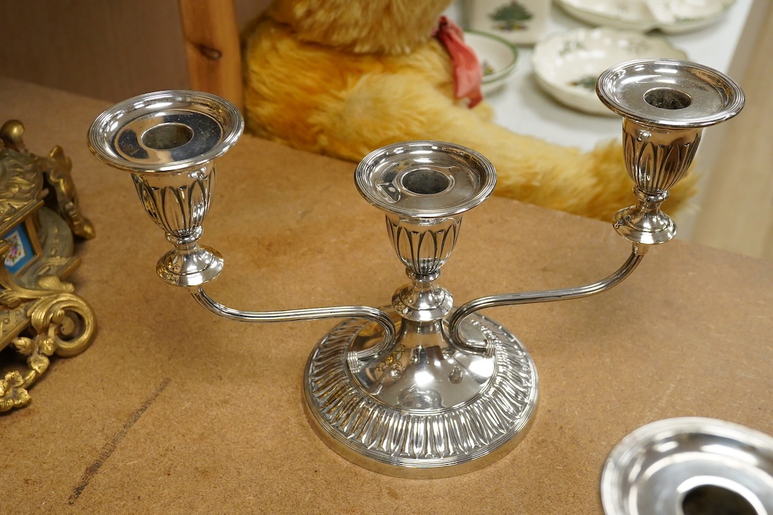 A pair of Elizabeth II silver mounted two branch, three light dwarf candelabra, by George Howson, Sheffield, 1959, height 16.7cm, weighted.